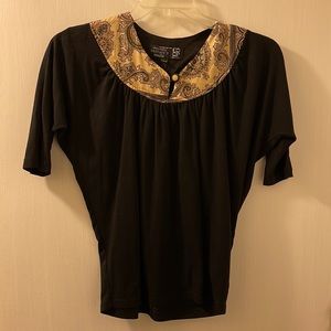 Black short sleeve shirt with paisley front.